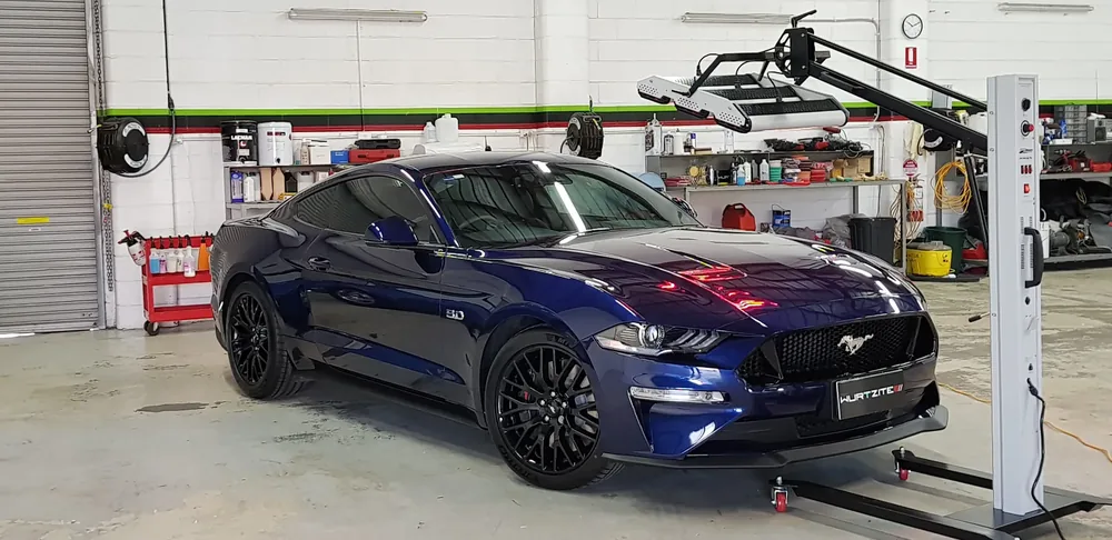 Blue Ford Mustang GT standing in an Adelaide detailing workshop after ceramic coating