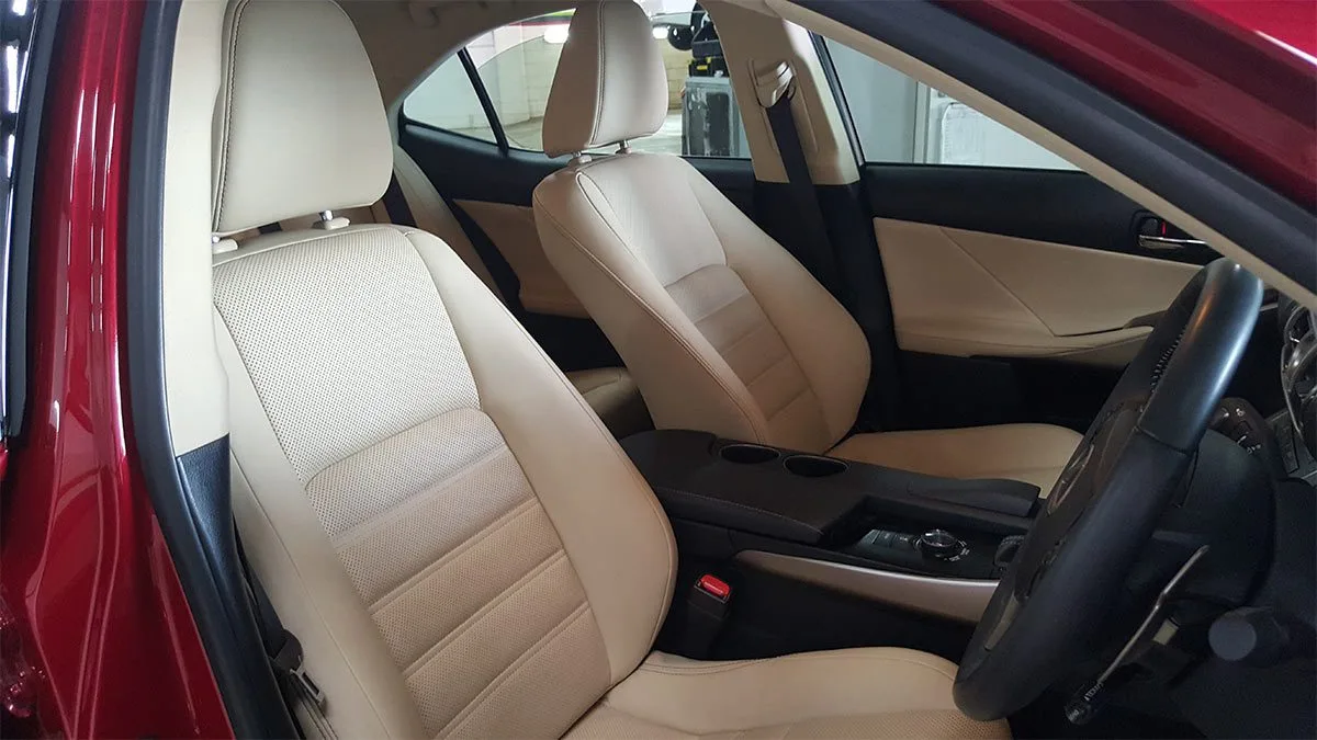 Cream leather front seats coated with Wurtzite interior protection in a sedan at Ceramicar Adelaide