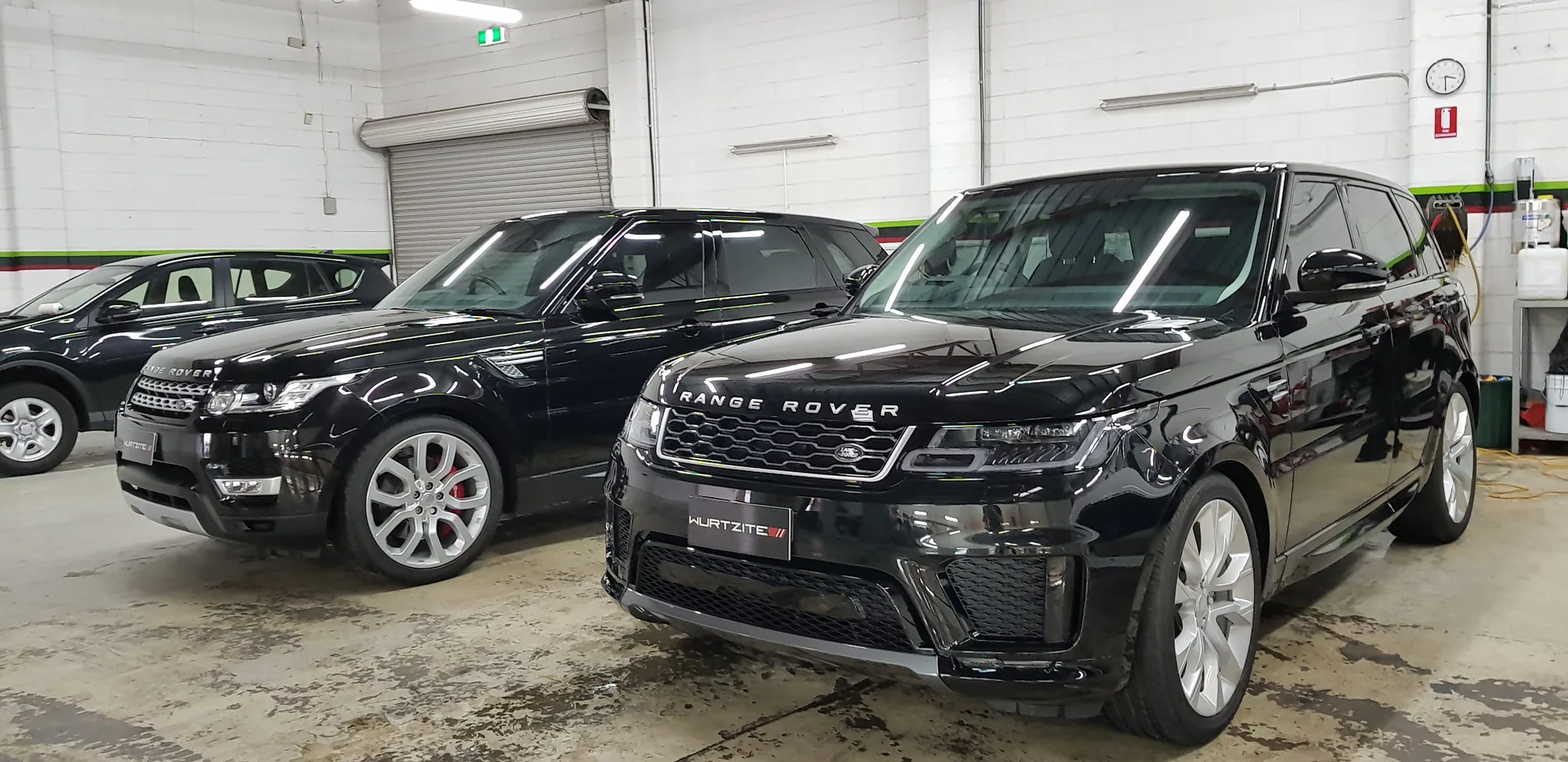 Two Range Rovers parked in the Ceramicar workshop for ceramic paint protection