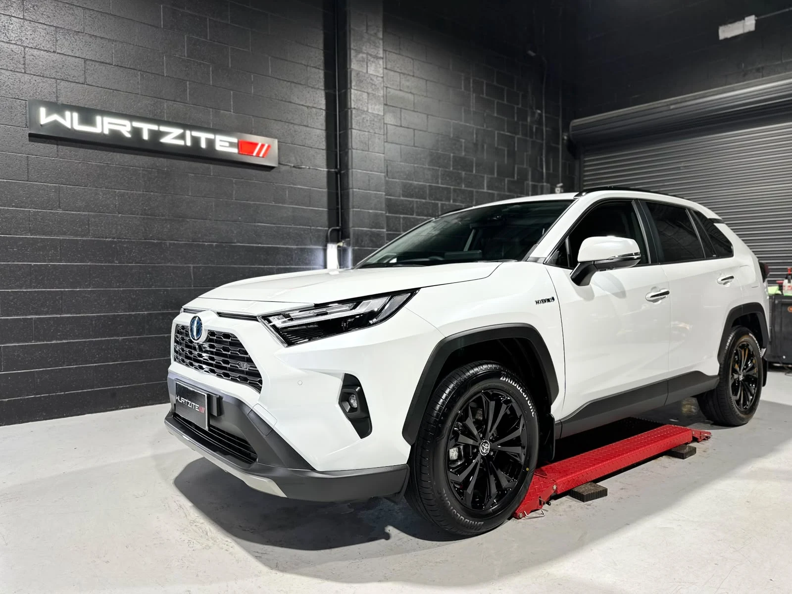 White Toyota RAV4 with dark side windows in the Ceramicar Adelaide tinting bay