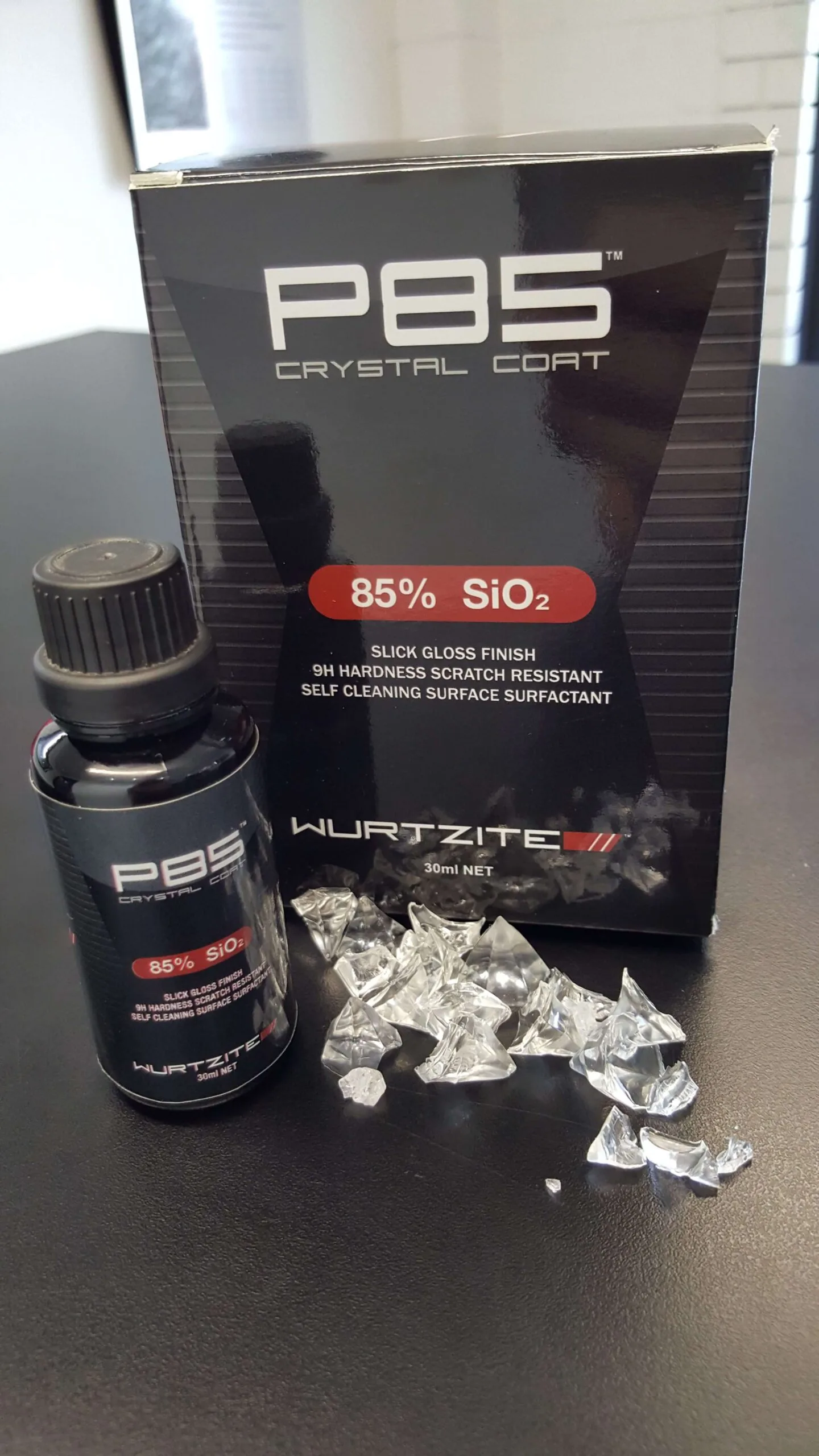 Wurtzite P85 Crystal Coat box and bottle with used applicator cloths on the bench